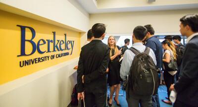 Image of a group of students talking with a Career Center staff member