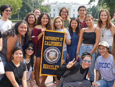 Group of students holding a University of California Berkeley banner in front of the White House